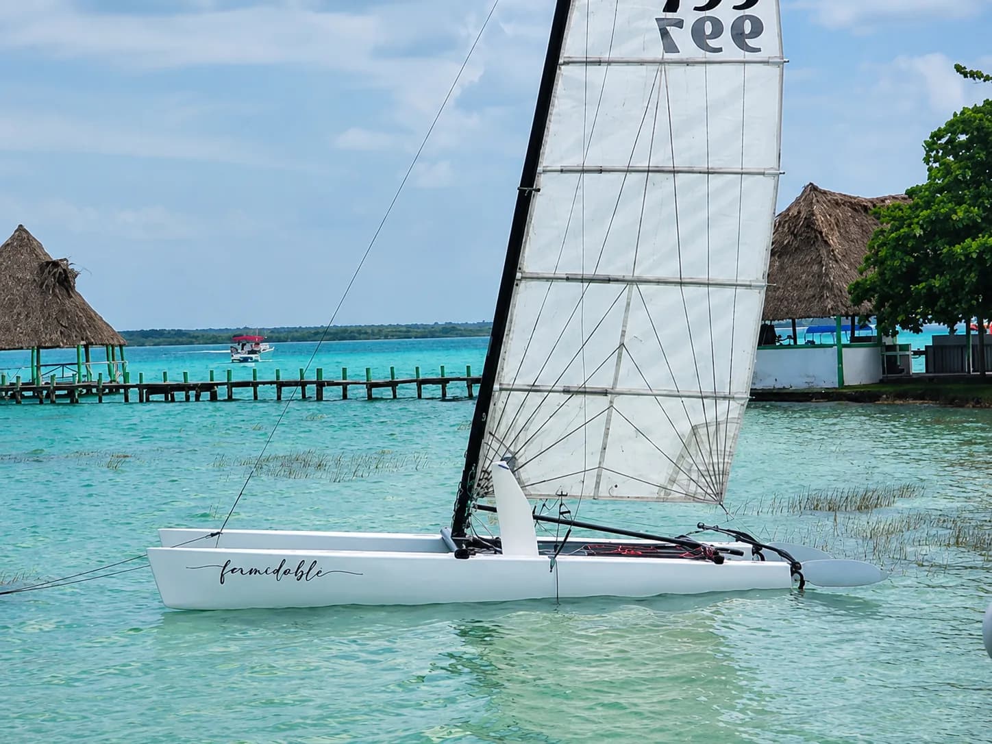 Hobie 20-foot catamaran sailing on Bacalar Lagoon